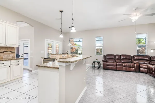 a room with furniture and flat screen tv