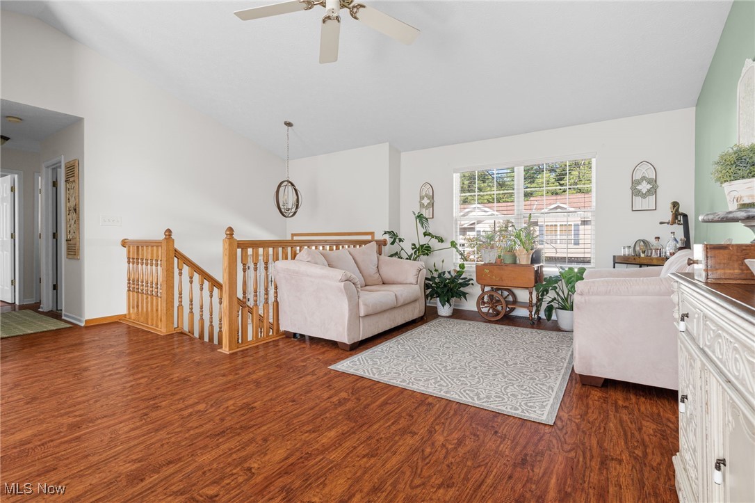 64 River Ridge Lane Munroe Falls, OH 44262 - Photo 6 of 25 Living room featuring lofted ceiling and dark wood-type flooring