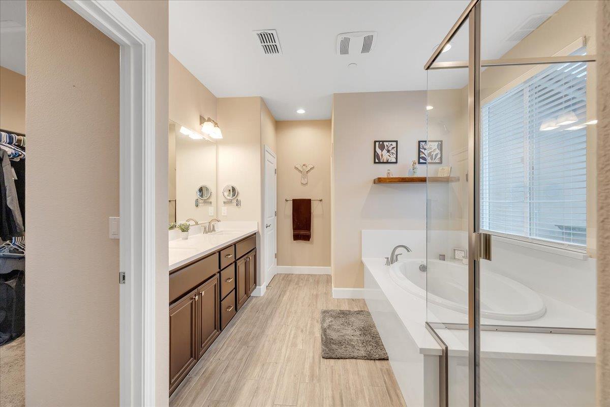 133 Palisades Place Copperopolis, CA 95228 - Photo 58 of 95 a bathroom with a sink a toilet a tub and shower