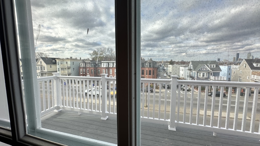 663 Columbia Road, Unit 3 Boston, MA 02125 - Photo 13 of 21 a view of a glass door with a glass door