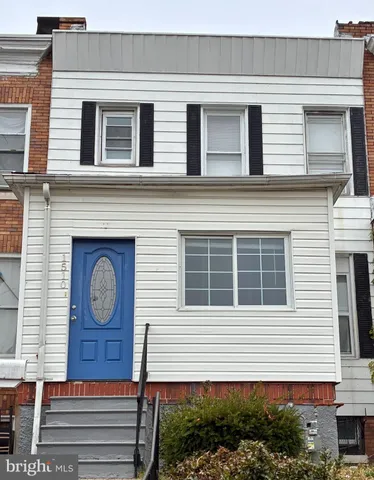 a front view of a house with brick walls