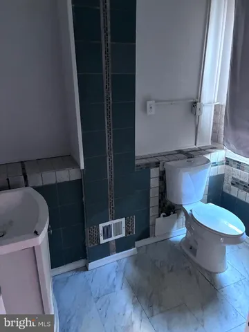 a bathroom with a sink and toilet