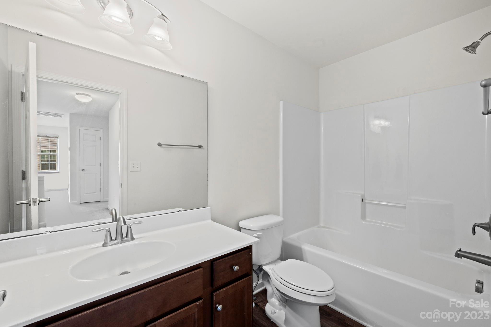 59 North River Road Fletcher, NC 28732 - Photo 25 of 36 a bathroom with a sink a toilet and a bathtub
