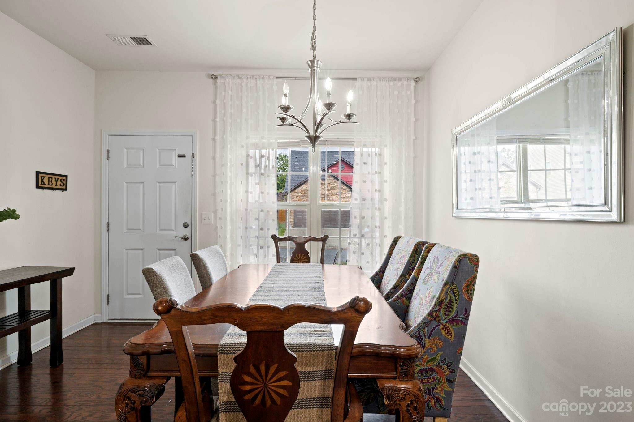 59 North River Road Fletcher, NC 28732 - Photo 5 of 36 a view of a dining room with furniture and a chandelier
