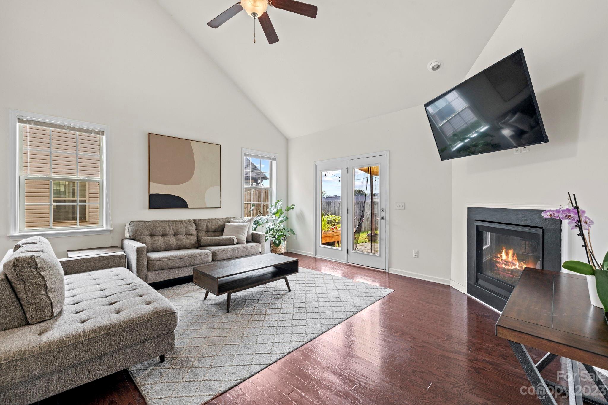 59 North River Road Fletcher, NC 28732 - Photo 7 of 36 a living room with furniture and a flat screen tv