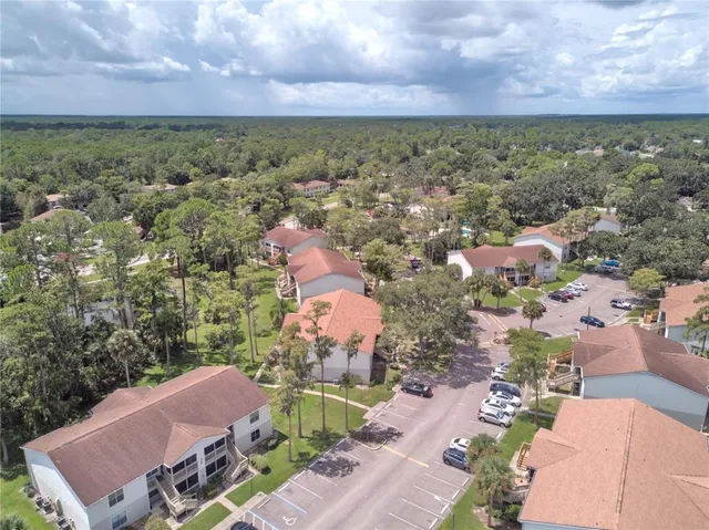 an aerial view of a houses with a outdoor space
