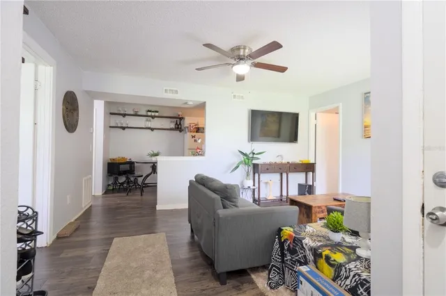 a living room with furniture and a window