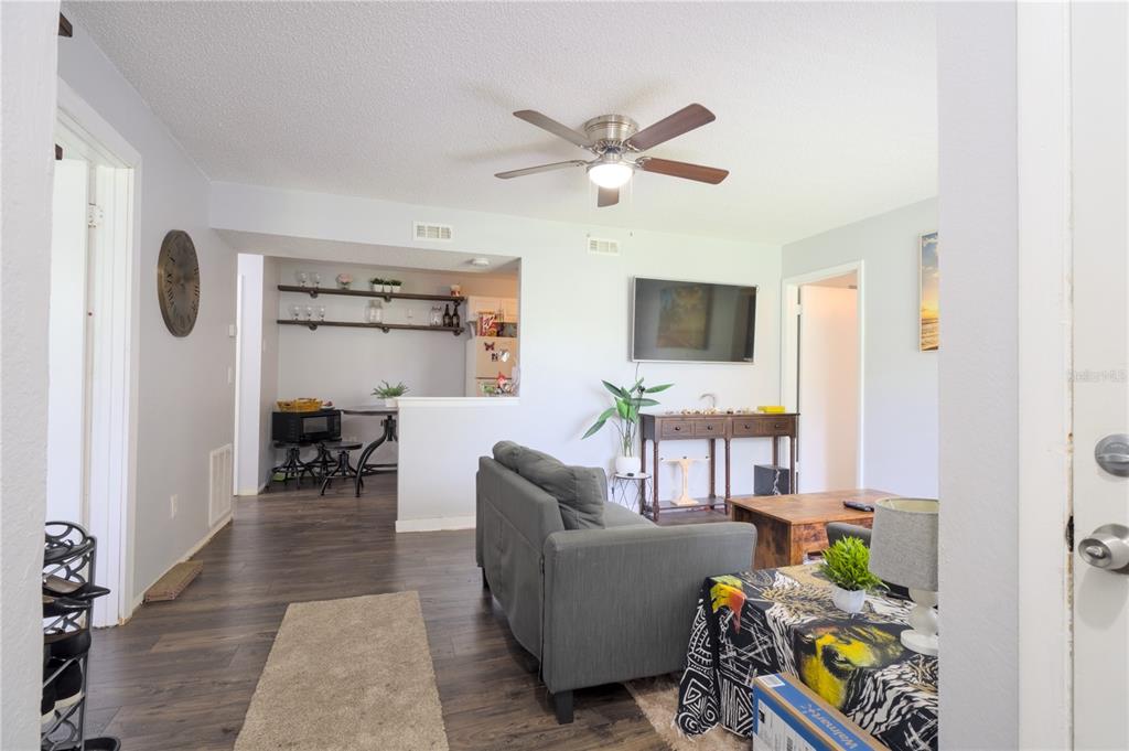 1600 Big Tree Road, Unit A7 South Daytona, FL 32119 - Photo 4 of 22 a living room with furniture and a window