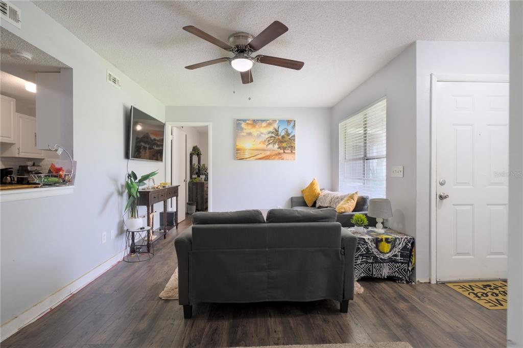 1600 Big Tree Road, Unit A7 South Daytona, FL 32119 - Photo 5 of 22 a living room with furniture and a flat screen tv