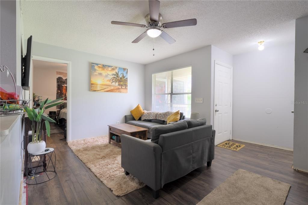 1600 Big Tree Road, Unit A7 South Daytona, FL 32119 - Photo 6 of 22 a living room with furniture and a window