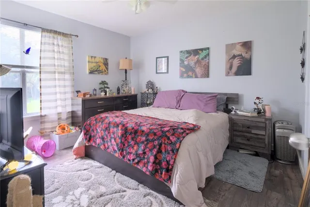 a bedroom with a bed and a window