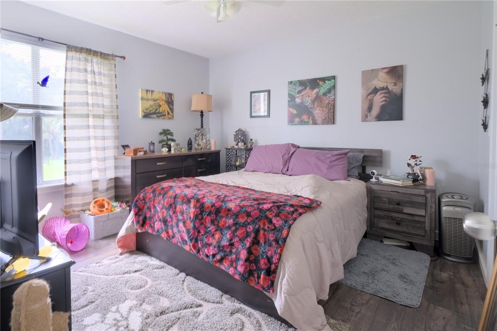 1600 Big Tree Road, Unit A7 South Daytona, FL 32119 - Photo 7 of 22 a bedroom with a bed and a window