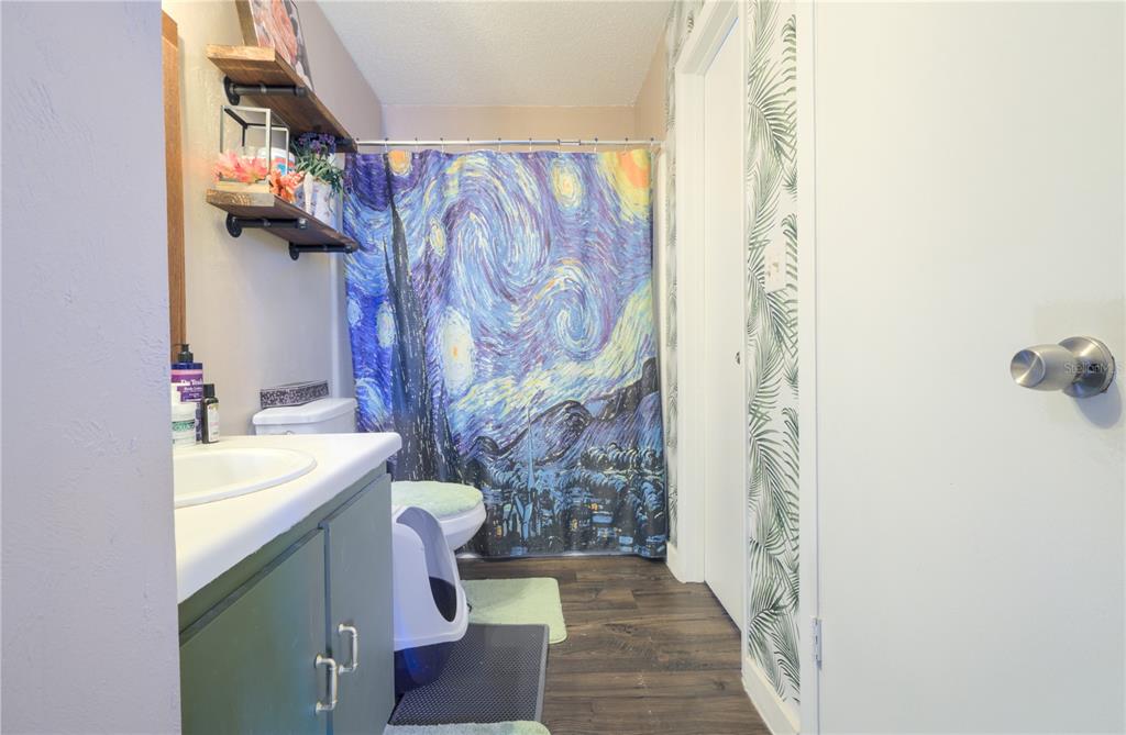 1600 Big Tree Road, Unit A7 South Daytona, FL 32119 - Photo 8 of 22 a bathroom with a sink and mirror with toilet