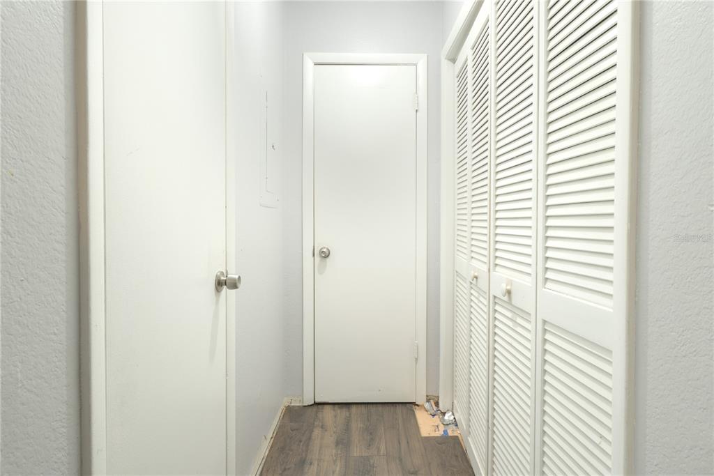 1600 Big Tree Road, Unit A7 South Daytona, FL 32119 - Photo 10 of 22 a view of a hallway with wooden floor and closet