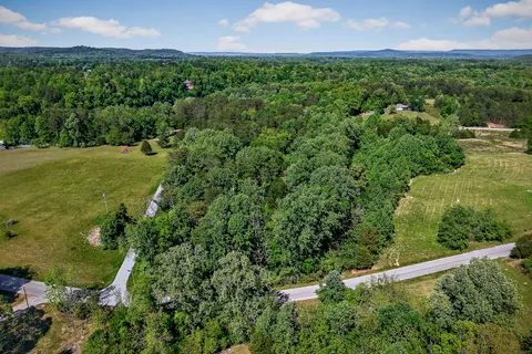 an aerial view of a golf course with houses