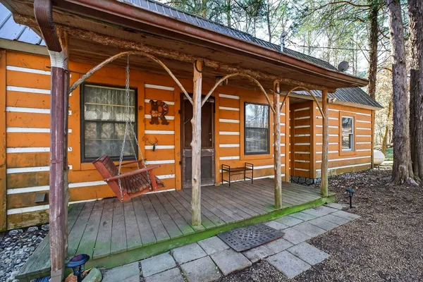 front view of a house with a front door and a couch