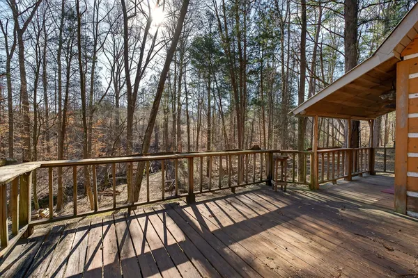 a view of a backyard with open kitchen