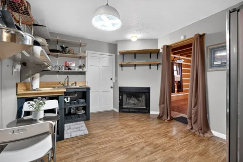 a bedroom with bed couch and window