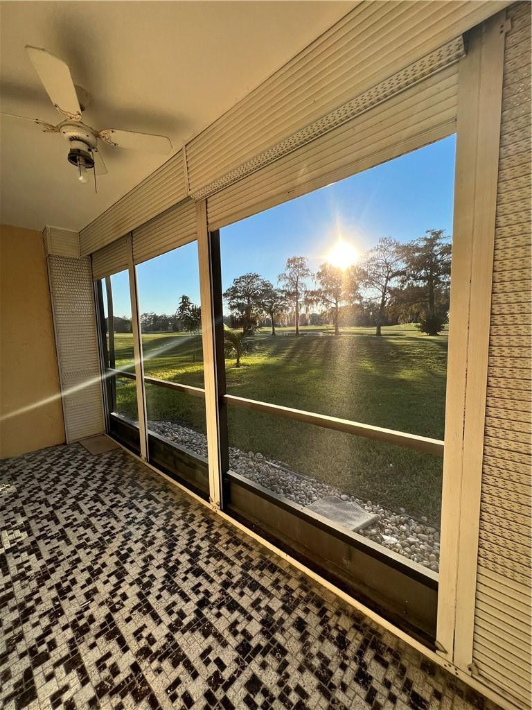 6451 North University Drive, Unit 112 Tamarac, FL 33321 - Photo 12 of 21 a view of a glass door with a yard