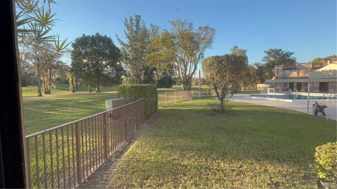 6451 North University Drive, Unit 112 Tamarac, FL 33321 - Photo 20 of 21 a view of a park with large trees