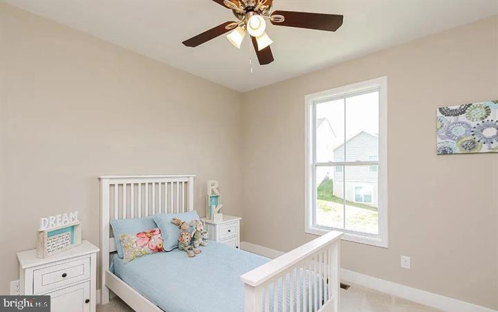 15 Glenaire Road Bunker Hill, WV 25413 - Photo 20 of 23 a bedroom with furniture and a window