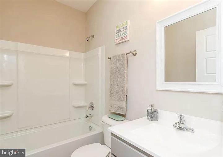 15 Glenaire Road Bunker Hill, WV 25413 - Photo 21 of 23 a bathroom with a sink a toilet and a bathtub