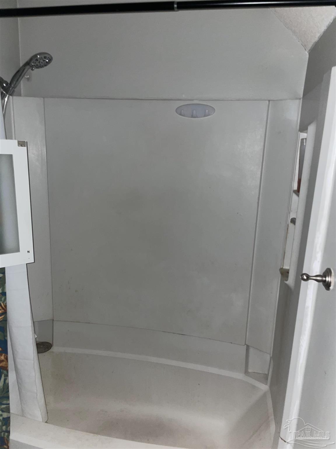 7150 Plantation Road, Unit 327 Pensacola, FL 32504 - Photo 18 of 24 a close up of a bathtub with shower