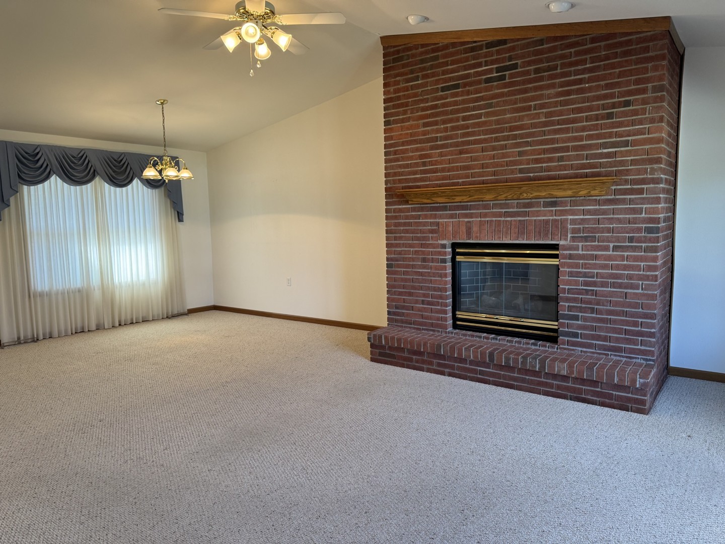 2800 Becker Drive Peru, IL 61354 - Photo 14 of 23 a view of an empty room with a fireplace