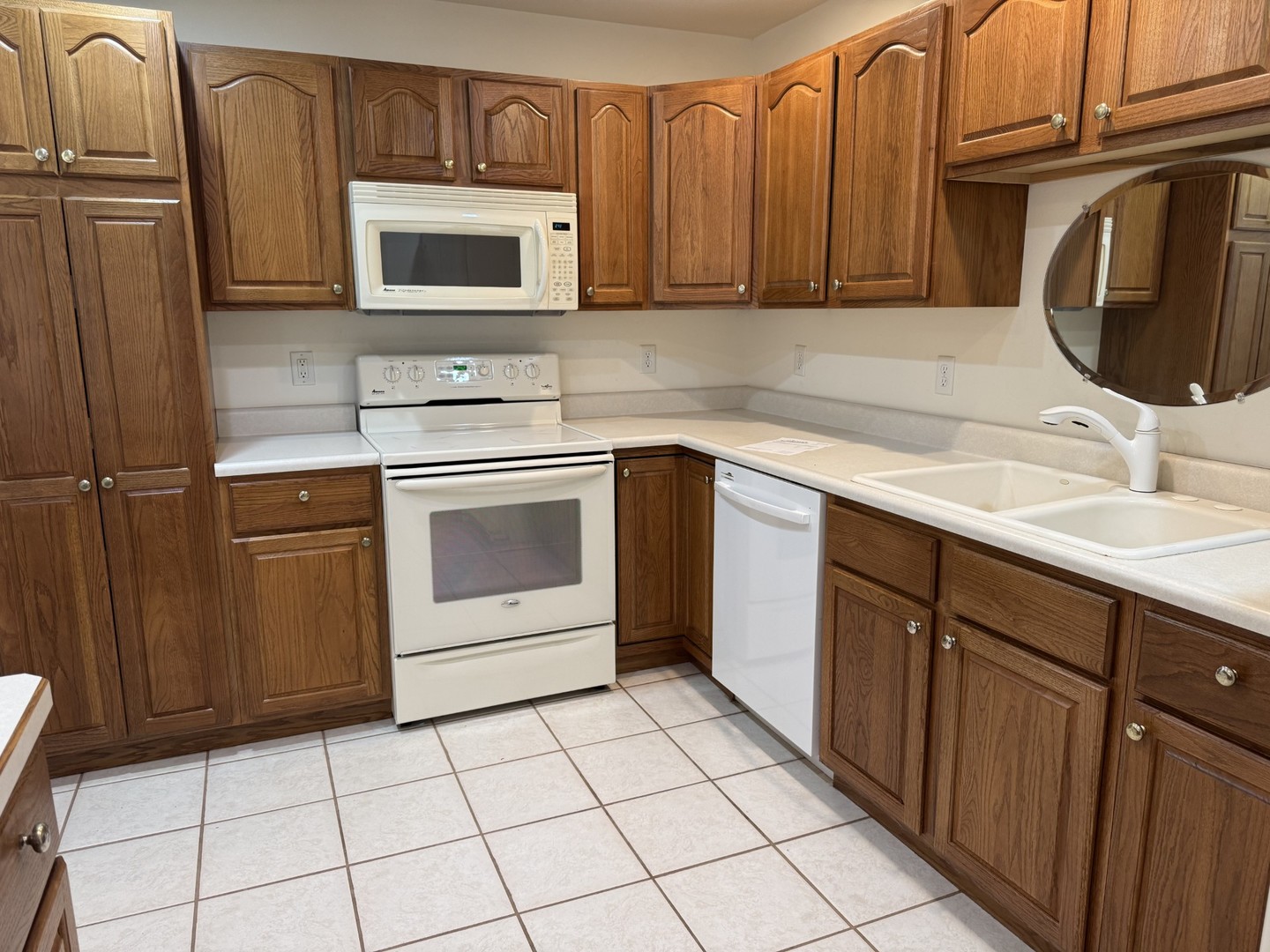 2800 Becker Drive Peru, IL 61354 - Photo 6 of 23 a kitchen with sink a microwave and cabinets