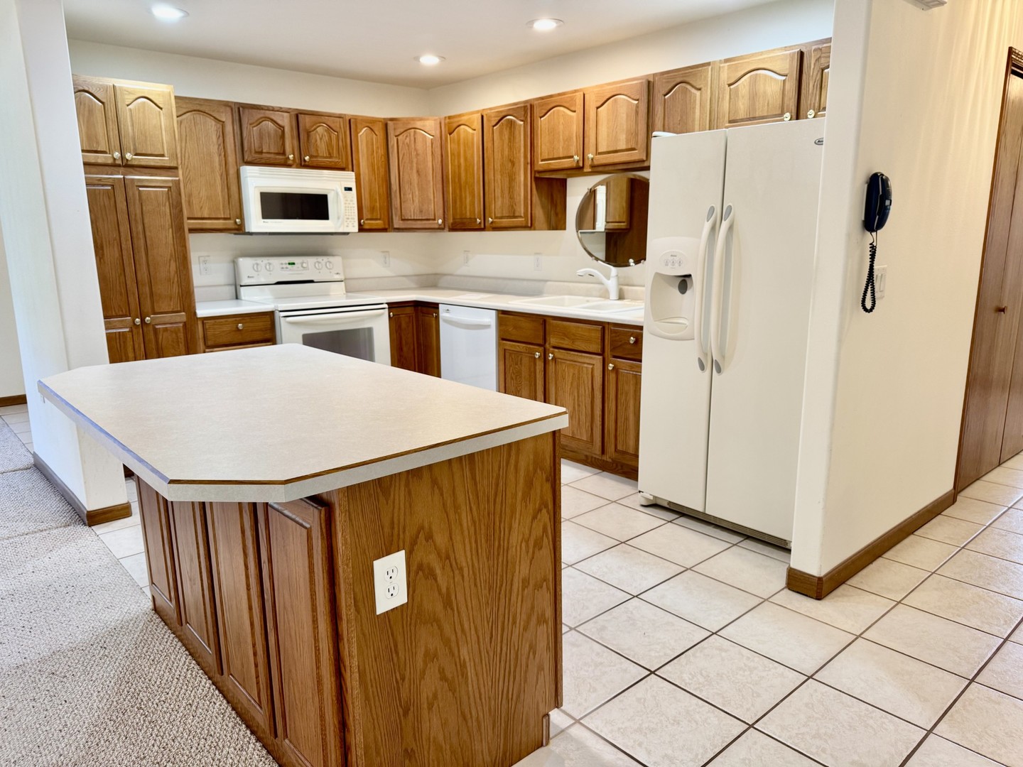 2800 Becker Drive Peru, IL 61354 - Photo 7 of 23 a kitchen with stainless steel appliances a refrigerator stove microwave and sink