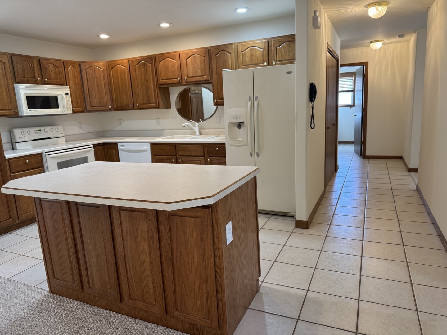 2800 Becker Drive Peru, IL 61354 - Photo 8 of 23 a kitchen with stainless steel appliances a refrigerator a stove a microwave and a sink