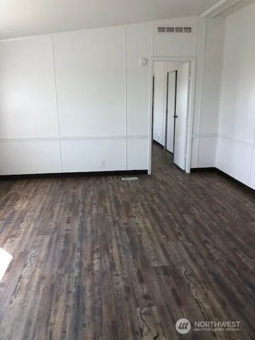 a view of a livingroom with wooden floor