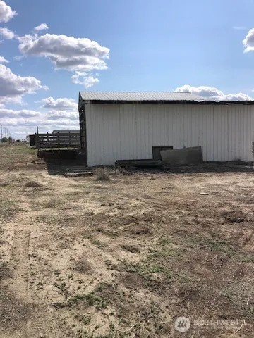 a view of a backyard of the house