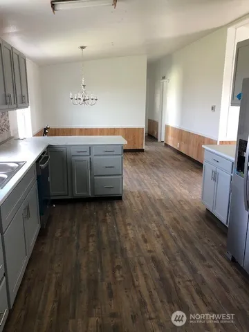 a kitchen with a sink and cabinets