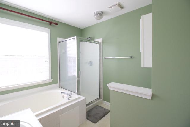 17 Ridgeway Road Stafford, VA 22556 - Photo 14 of 24 a bathroom with a tub and a shower