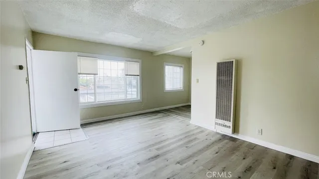 a close view of shoes stand and kitchen view