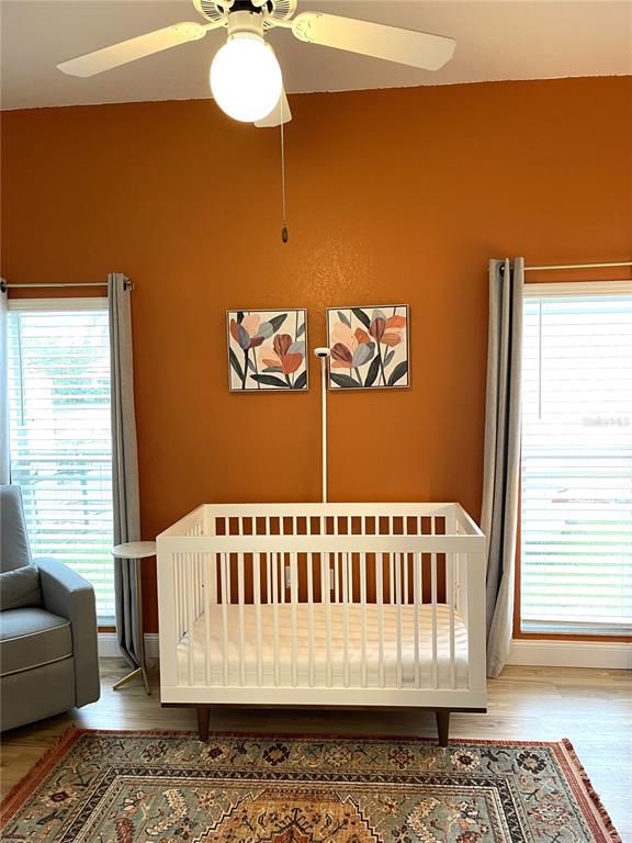 5941 Velvet Loop Lakeland, FL 33811 - Photo 16 of 61 a view of a bedroom with wooden floor