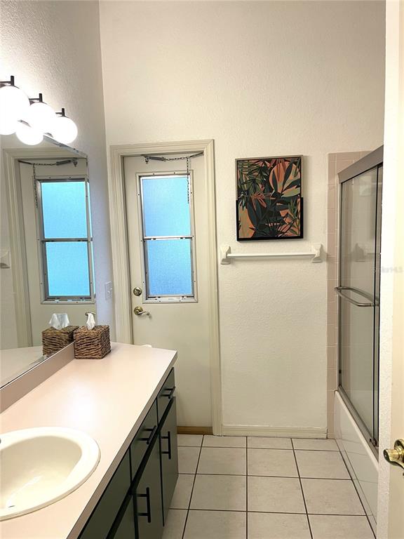5941 Velvet Loop Lakeland, FL 33811 - Photo 24 of 61 a bathroom with a sink and a mirror
