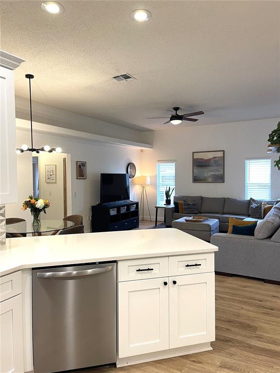 5941 Velvet Loop Lakeland, FL 33811 - Photo 36 of 61 a kitchen with a stove and a living room