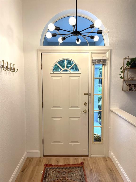 5941 Velvet Loop Lakeland, FL 33811 - Photo 4 of 61 a view of hallway with wooden floor