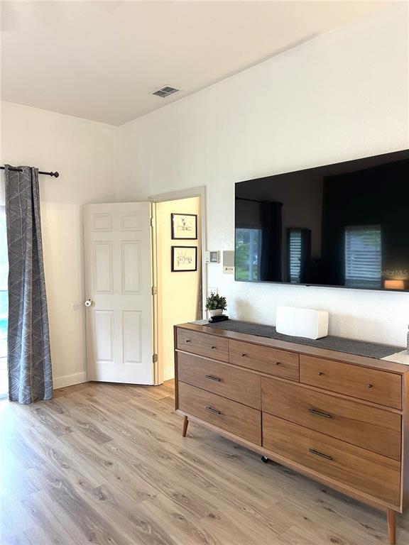 5941 Velvet Loop Lakeland, FL 33811 - Photo 48 of 61 a room with a bed and a flat screen tv