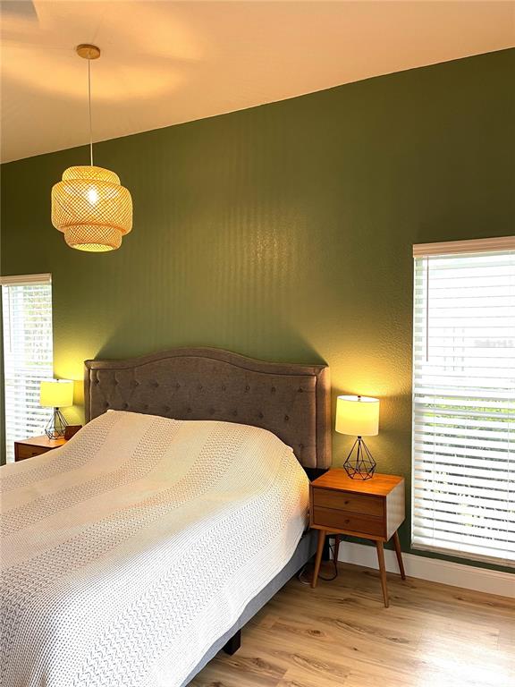 5941 Velvet Loop Lakeland, FL 33811 - Photo 50 of 61 a spacious bedroom with a bed and a chandelier