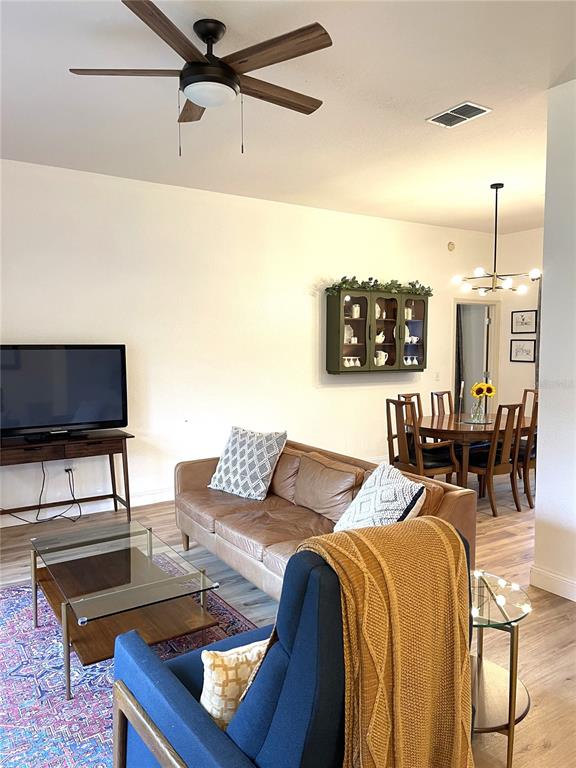 5941 Velvet Loop Lakeland, FL 33811 - Photo 5 of 61 a living room with furniture and a flat screen tv