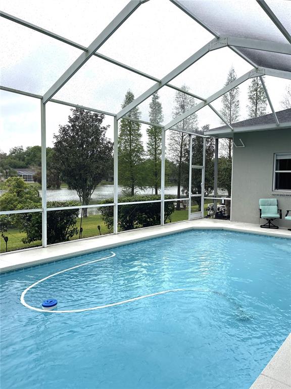 5941 Velvet Loop Lakeland, FL 33811 - Photo 54 of 61 a view of a swimming pool with a porch