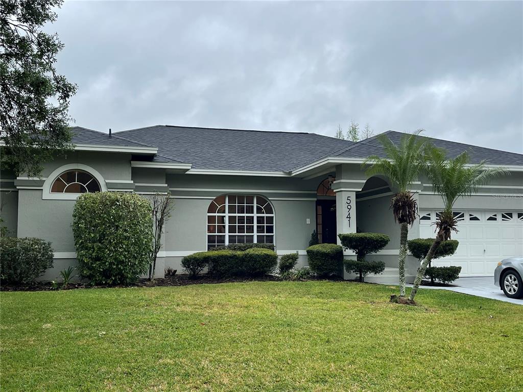 5941 Velvet Loop Lakeland, FL 33811 - Photo 61 of 61 a front view of a house with garden