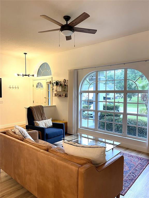 5941 Velvet Loop Lakeland, FL 33811 - Photo 7 of 61 a living room with furniture and a large window
