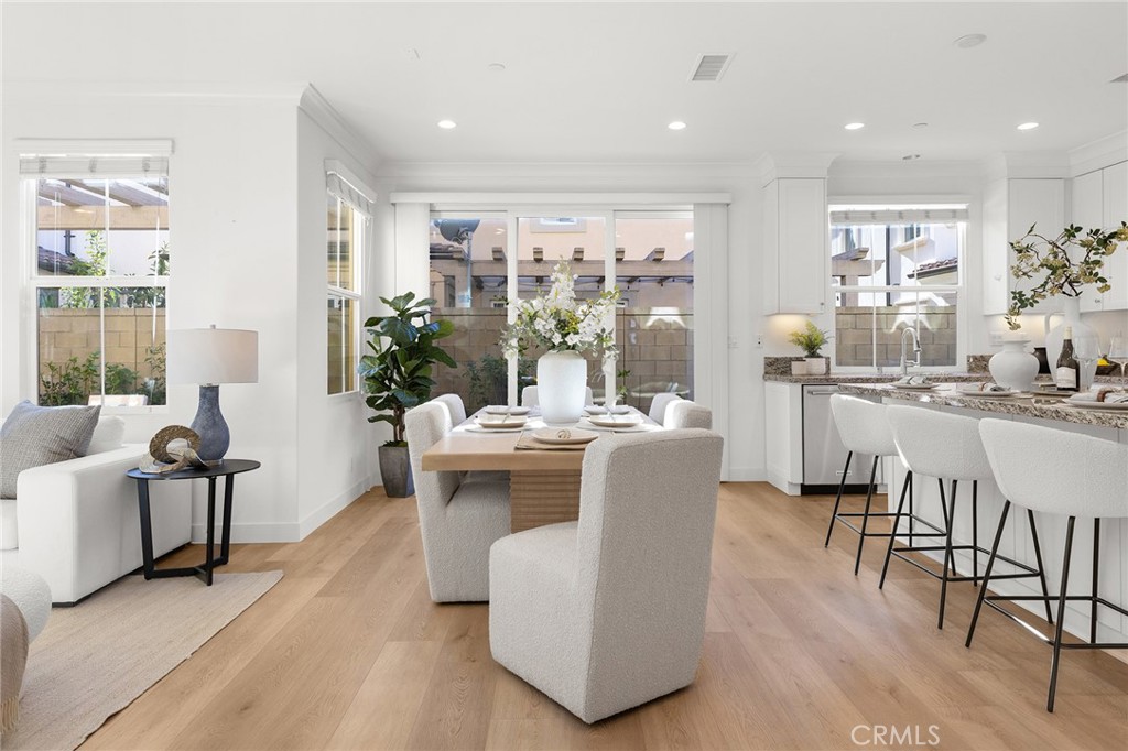 112 Velvetleaf Irvine, CA 92620 - Photo 12 of 51 a living room with furniture dining table and a large window
