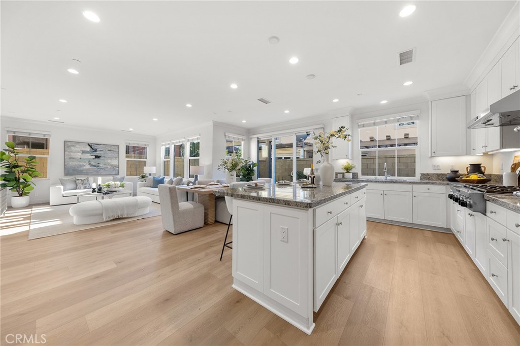 112 Velvetleaf Irvine, CA 92620 - Photo 17 of 51 a kitchen with counter top space a sink cabinets and stainless steel appliances