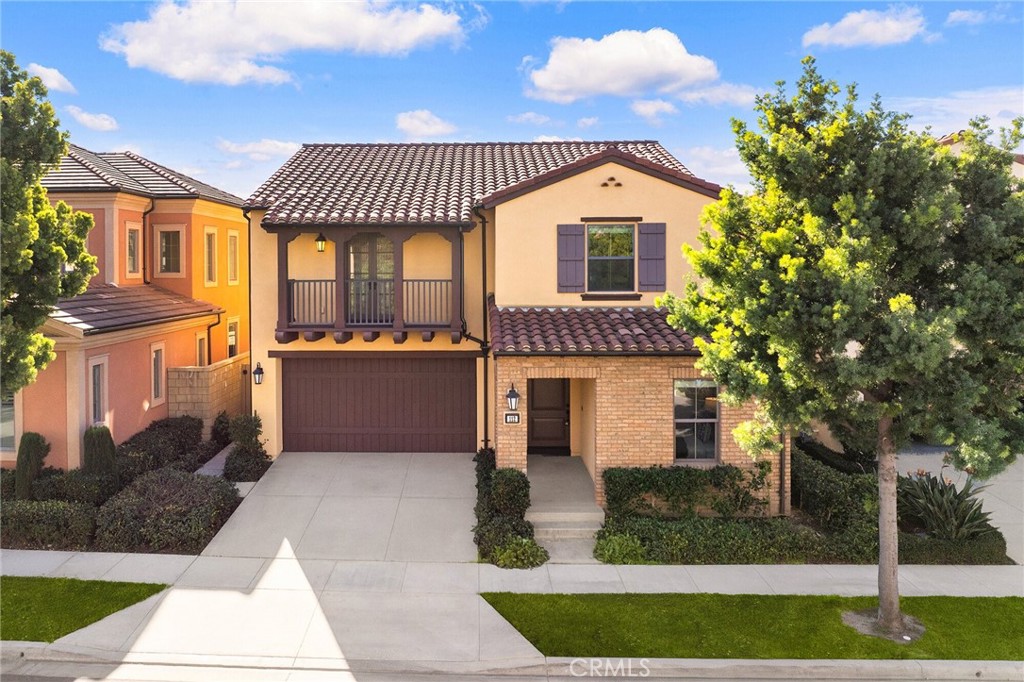 112 Velvetleaf Irvine, CA 92620 - Photo 2 of 51 a front view of a house with a garden