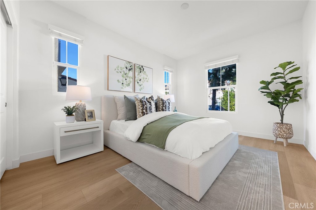 112 Velvetleaf Irvine, CA 92620 - Photo 21 of 51 a bedroom with a large bed and a couch